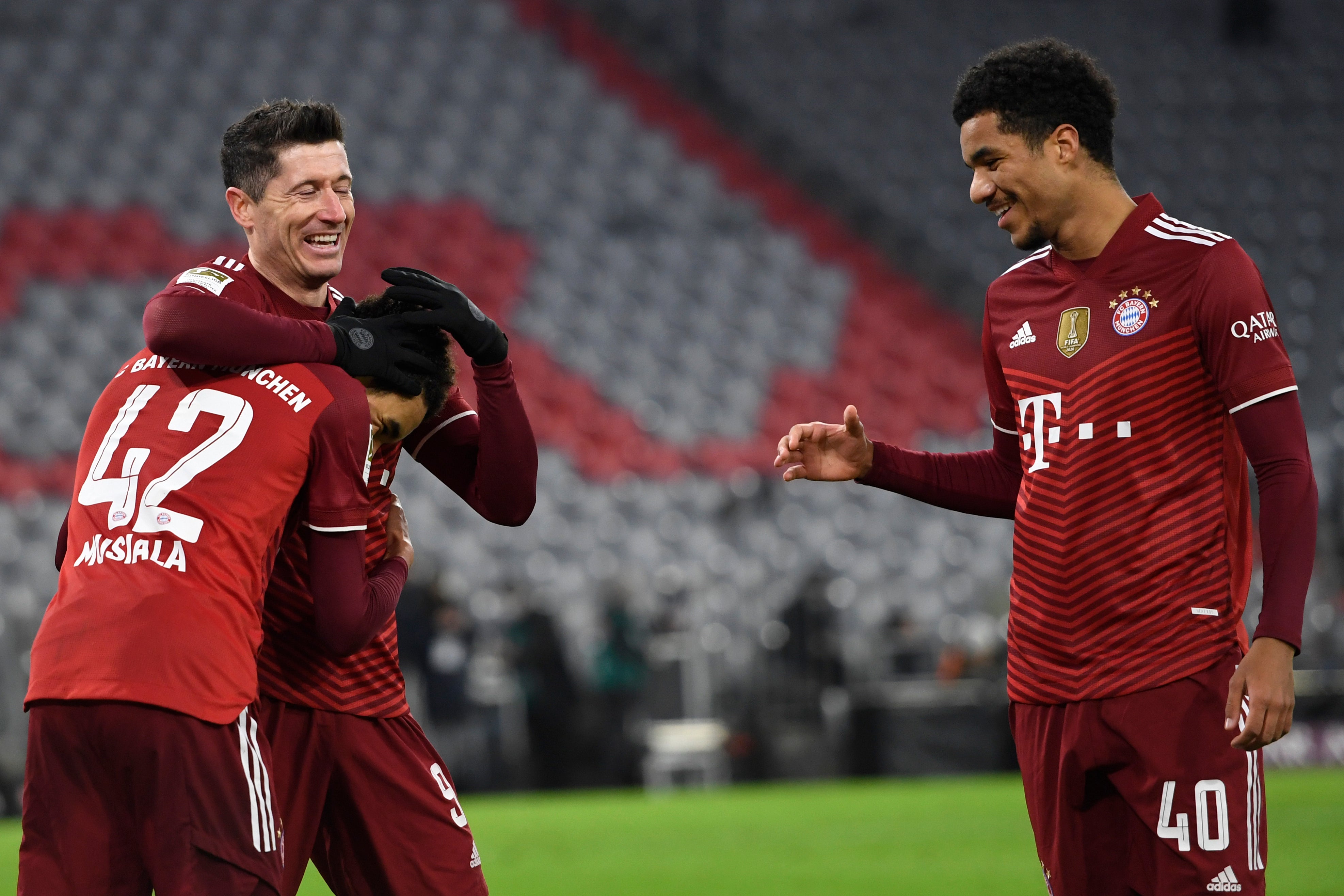 Robert Lewandowski (centre) celebrates with Bayern’s Jamal Musiala (left) and Malik Tillman (Andreas Schaad/AP)