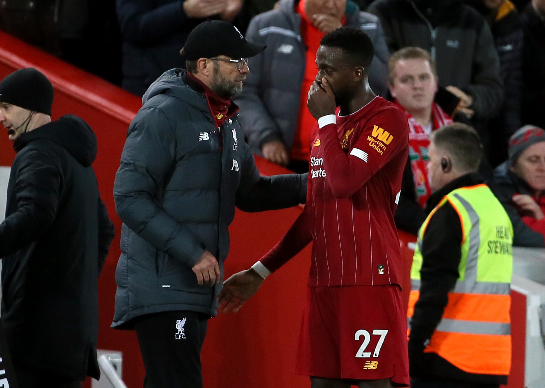 Liverpool manager Jurgen Klopp, left, will be well aware that Divock Origi will be out of contract next summer (Richard Sellers/PA)