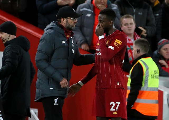 Liverpool manager Jurgen Klopp, left, will be well aware that Divock Origi will be out of contract next summer (Richard Sellers/PA)