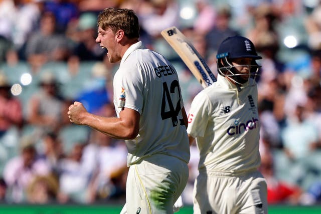 Australia’s Cameron Green, left, celebrates taking the wicket of England’s Joe Root, right (James Elsby/AP)