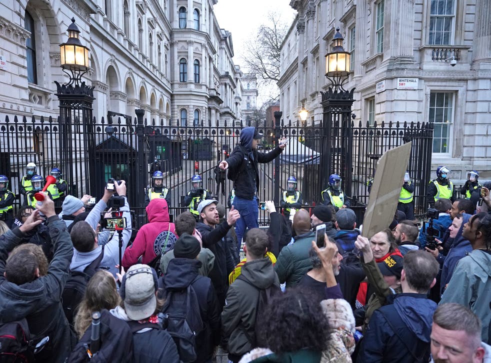 Anti-vaccination protesters demonstrate on Whitehall near Downing Street, London (Ian West/PA)