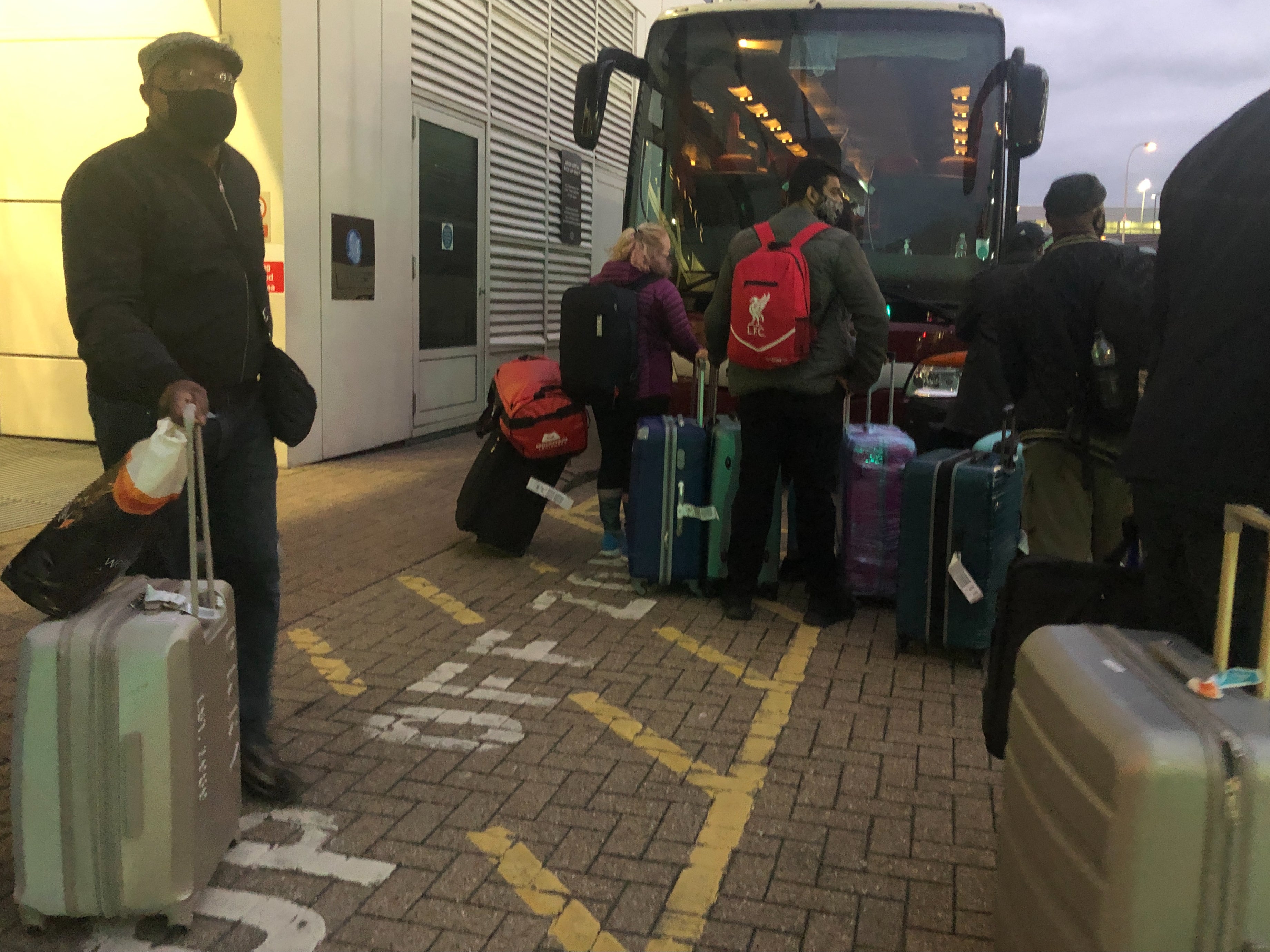 Leaving day: Travellers leaving their quarantine hotel at Gatwick airport