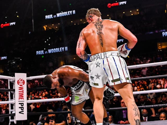<p>Jake Paul (right) knocks out Tyron Woodley in the sixth round</p>