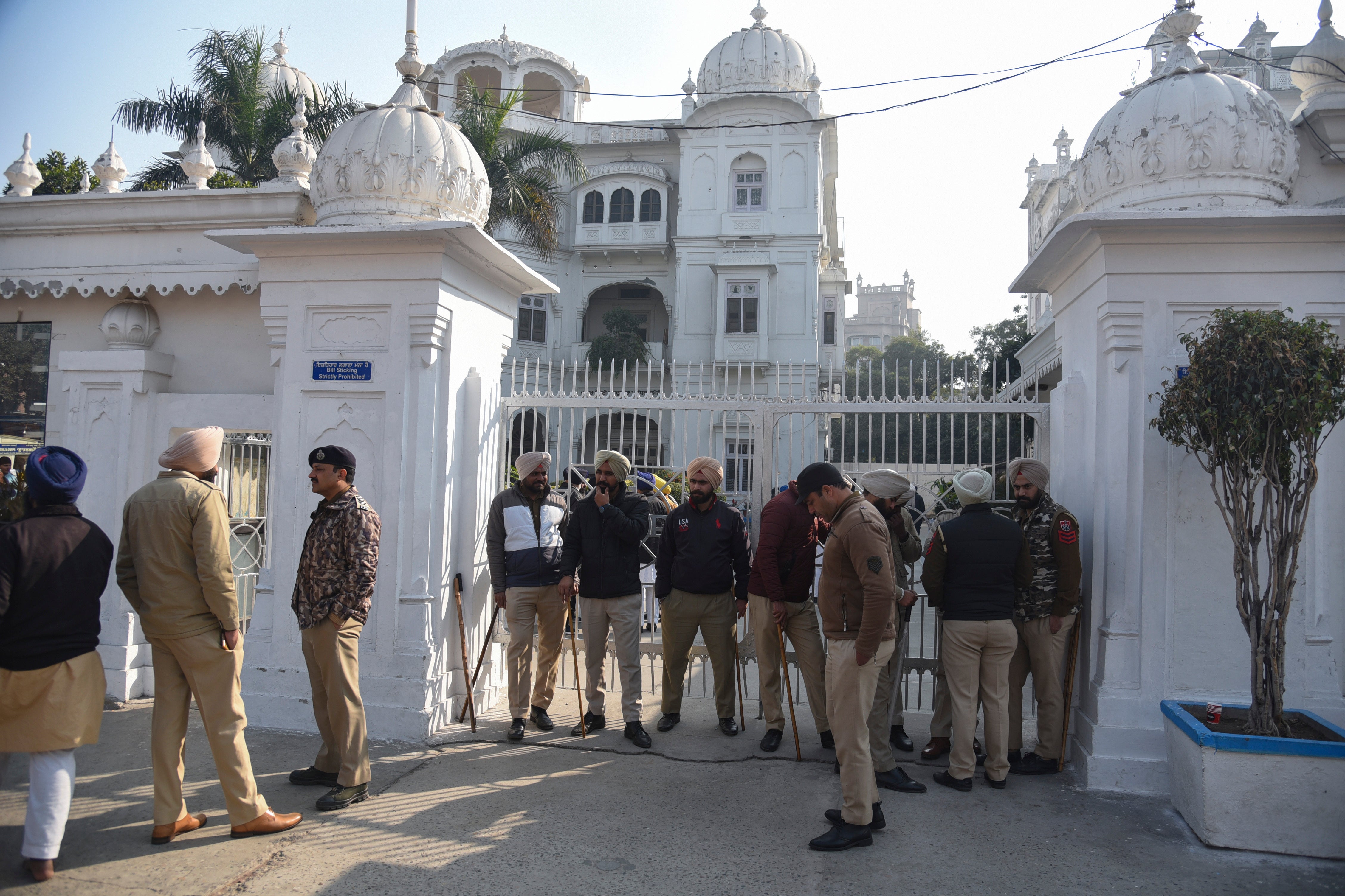 Indian policemen stand guard outside the office of Shiromani Gurdwara Parbandhak Committee, the organization responsible for the management of Sikh temples near the Golden Temple i