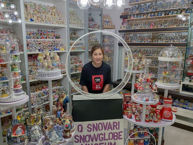 <p>Wendy Suen with her snow globe collection</p>