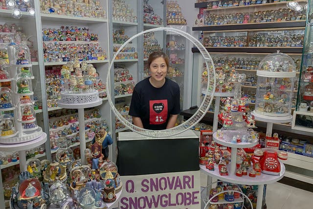 <p>Wendy Suen with her snow globe collection</p>