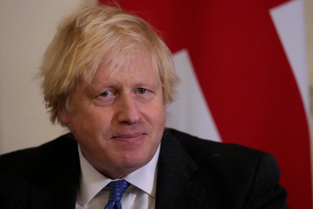 UK's Johnson walks tightrope between politics, COVID surge