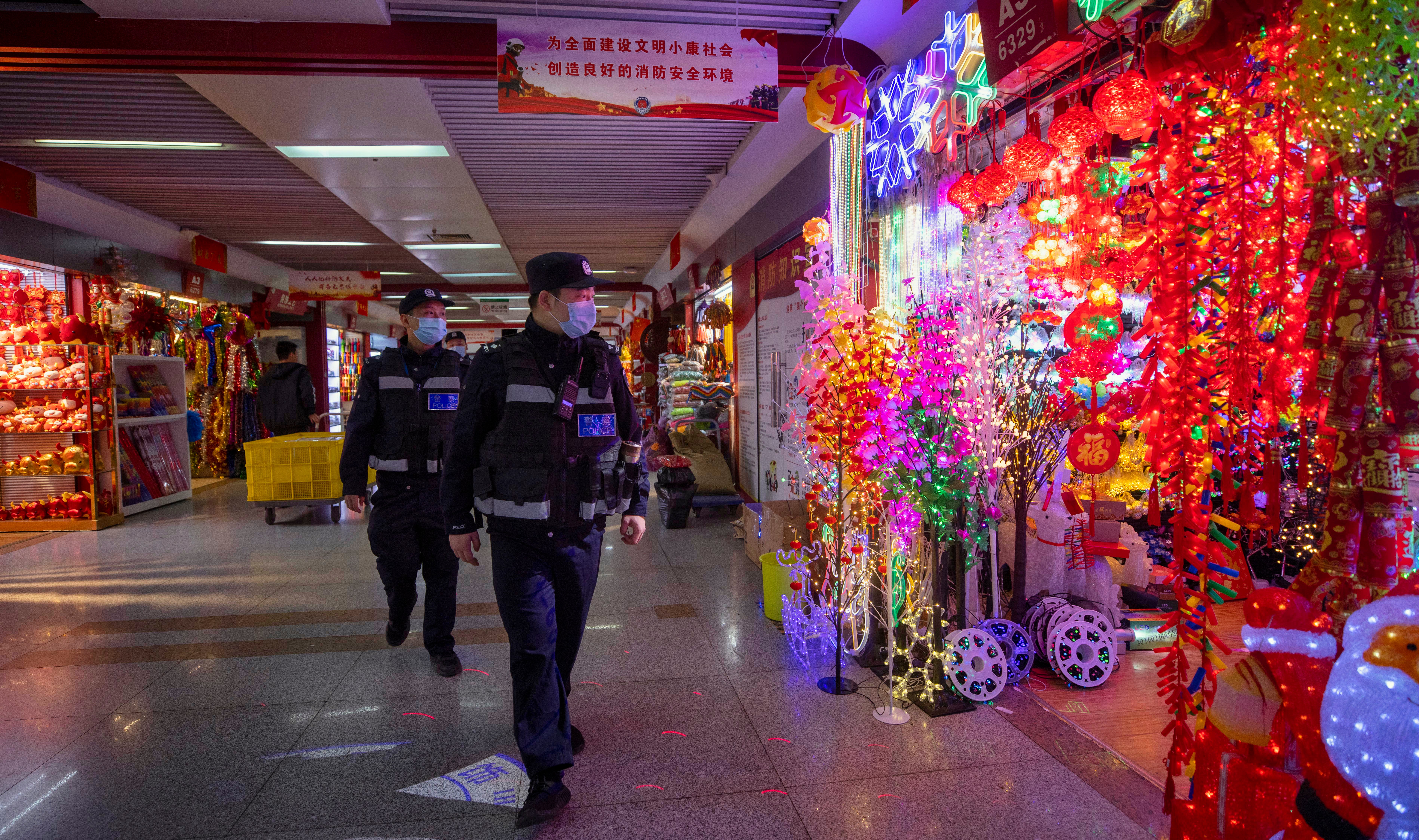 File photo: Police officers patrol inspect Christmas and New Year decorations in Yiwu, China, 11 December 2020