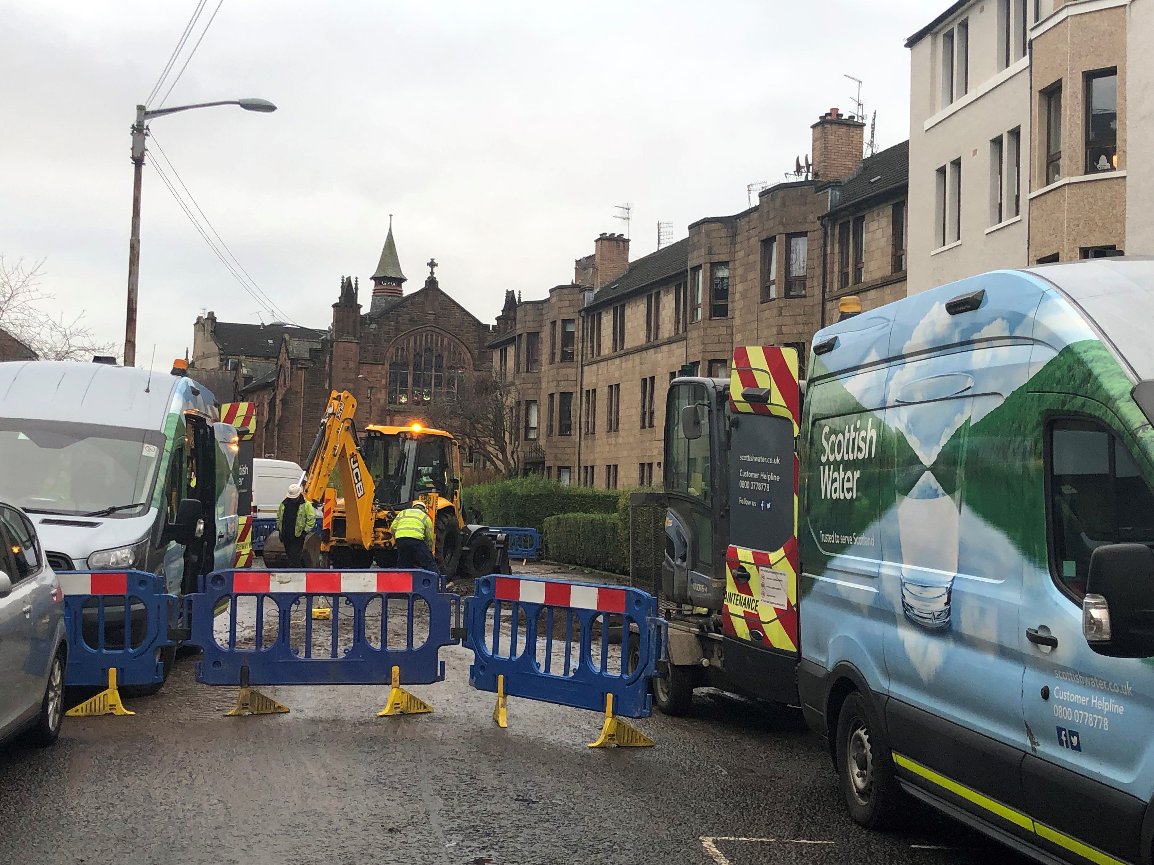 Scottish Water workers in Deanston Drive, Glasgow (PA)