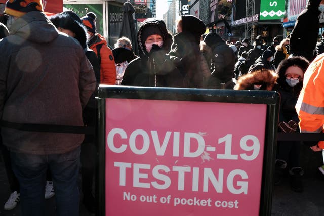 <p>People wait in long lines in Times Square to get tested for Covid-19 on December 20, 2021 in New York City. New York City, which was initially overwhelmed by the Covid pandemic, has once again seen case numbers surge as the new omicron variant becomes dominant. (Photo by Spencer Platt/Getty Images)</p>