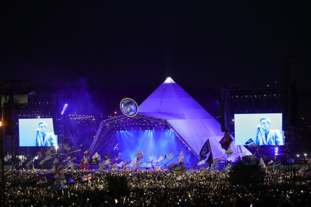 <p>The Killers playing the Pyramid Stage at Glastonbury Festival in 2019 (PA)</p>