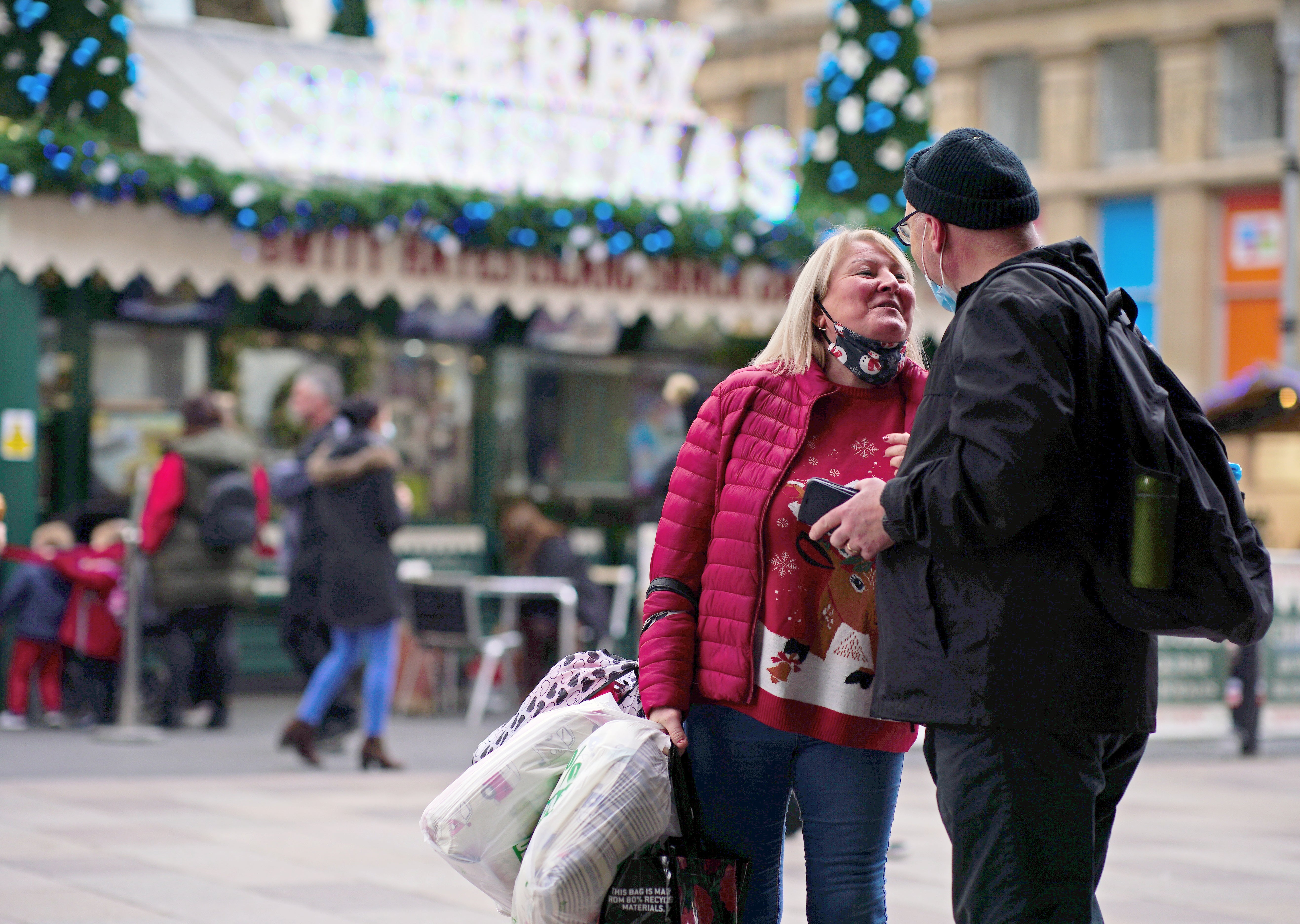 Christmas shoppers walk through the centre of Cardiff, Wales (Ben Birchall/PA)