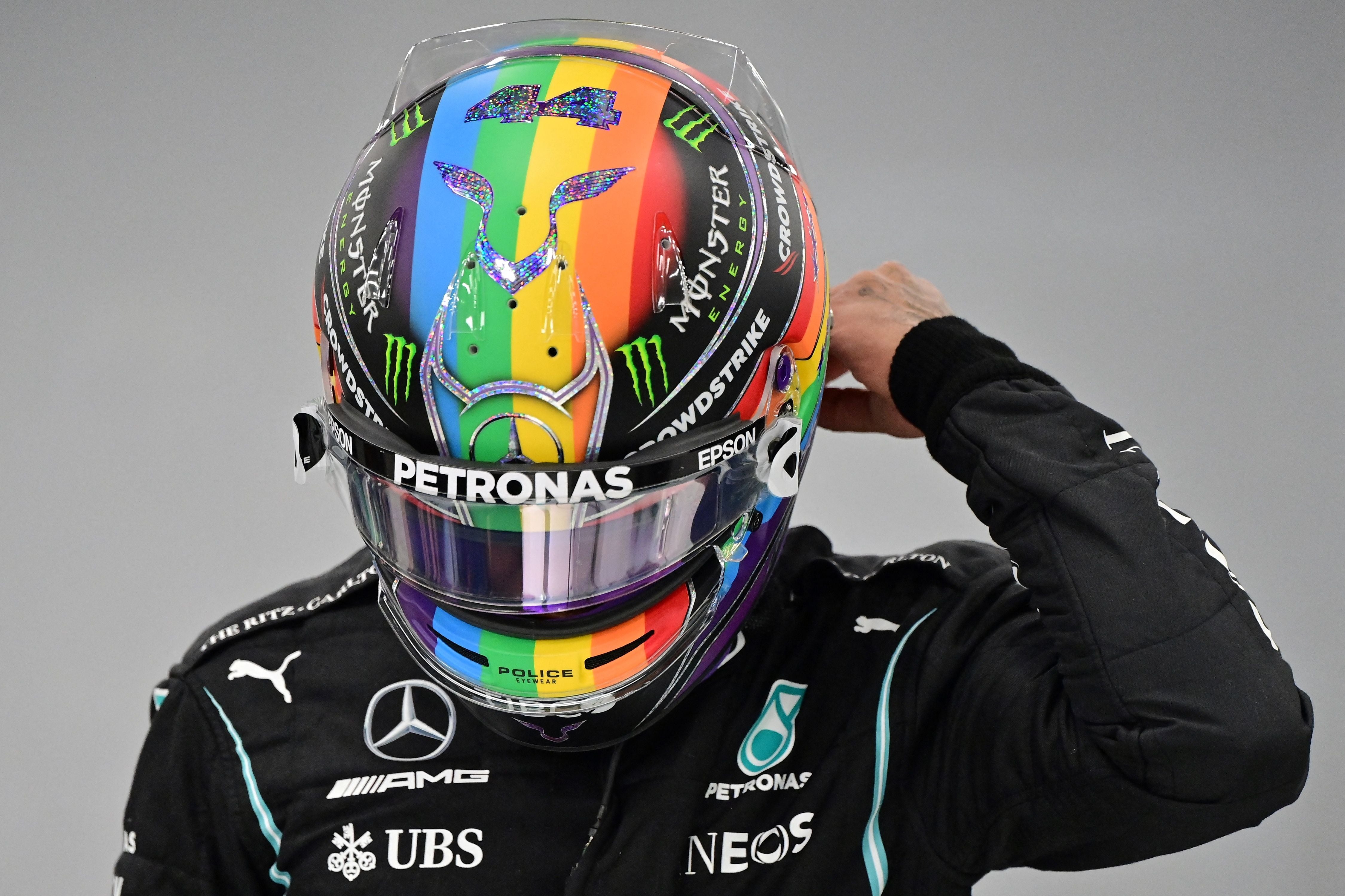 Lewis Hamilton makes a gesture in support of the LBGT+ community