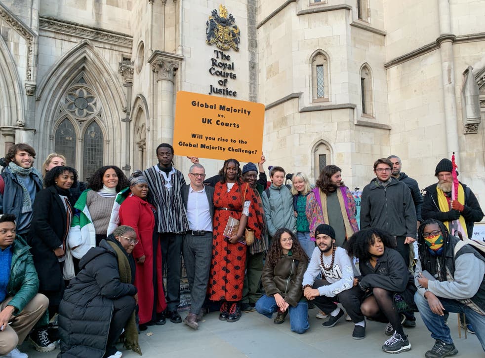<p>Climate activists outside the Royal Courts of Justice in London</p>
