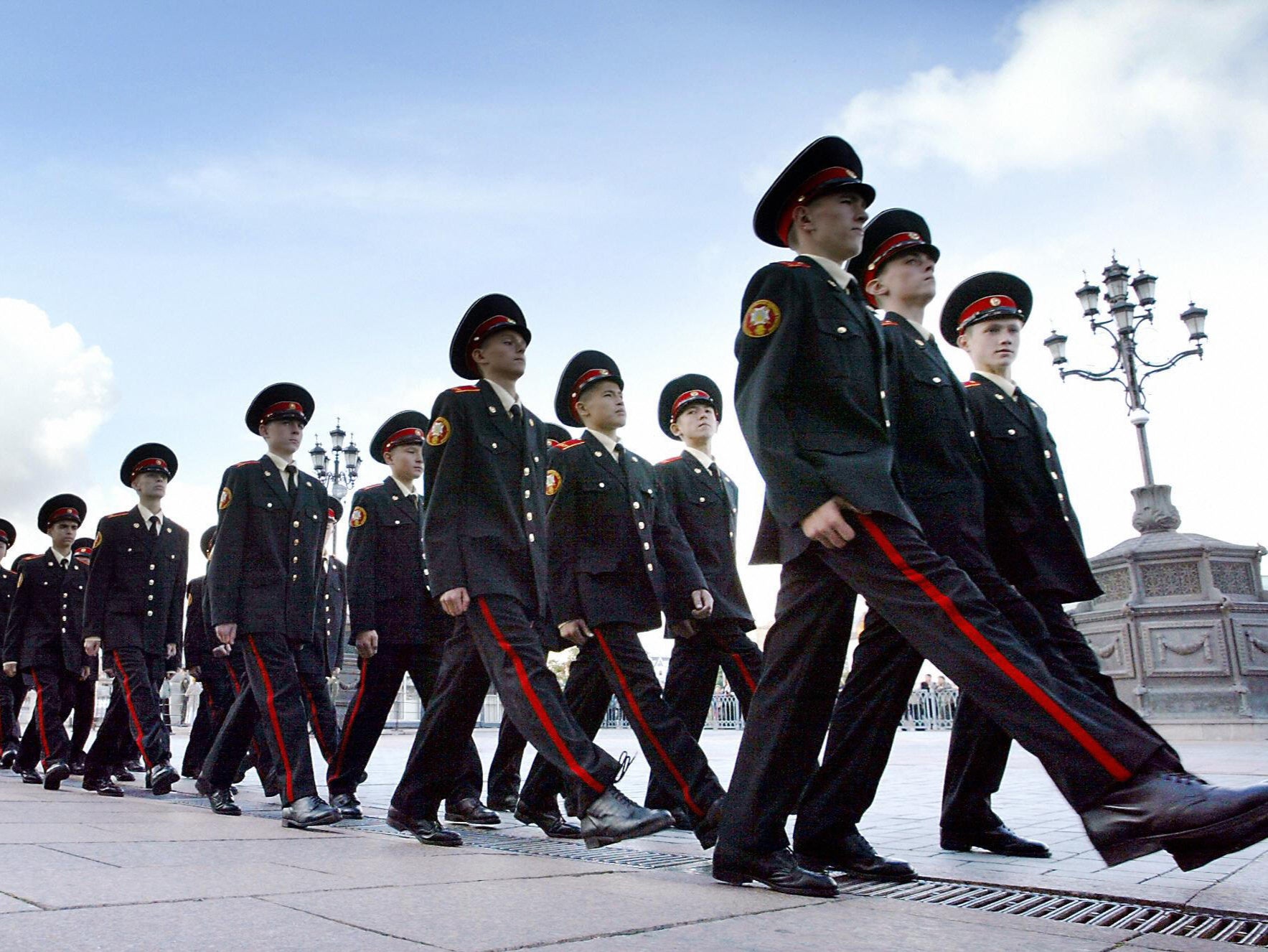 Military school cadets in Moscow march outside the cathedral of Christ the Saviour during a ceremony marking the beginning of their education