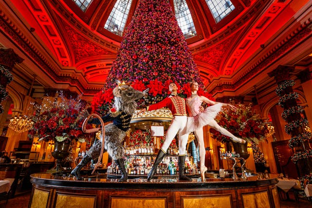 Scottish Ballet dancers Roseanna Leney as The Sugarplum Fairy, Jerome Barnes as The Nutcracker Prince and Javier Andreu as The Rat King posing in The Dome bar Edinburgh, underneath their famous Christmas tree (Andrew Perry/Scottish Ballet)
