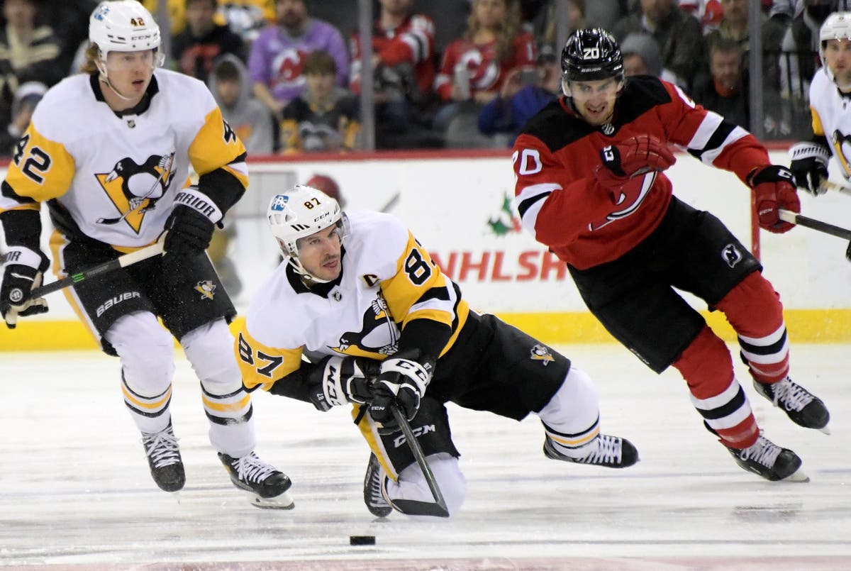 AP source: NHL to withdraw from Olympics after COVID surge