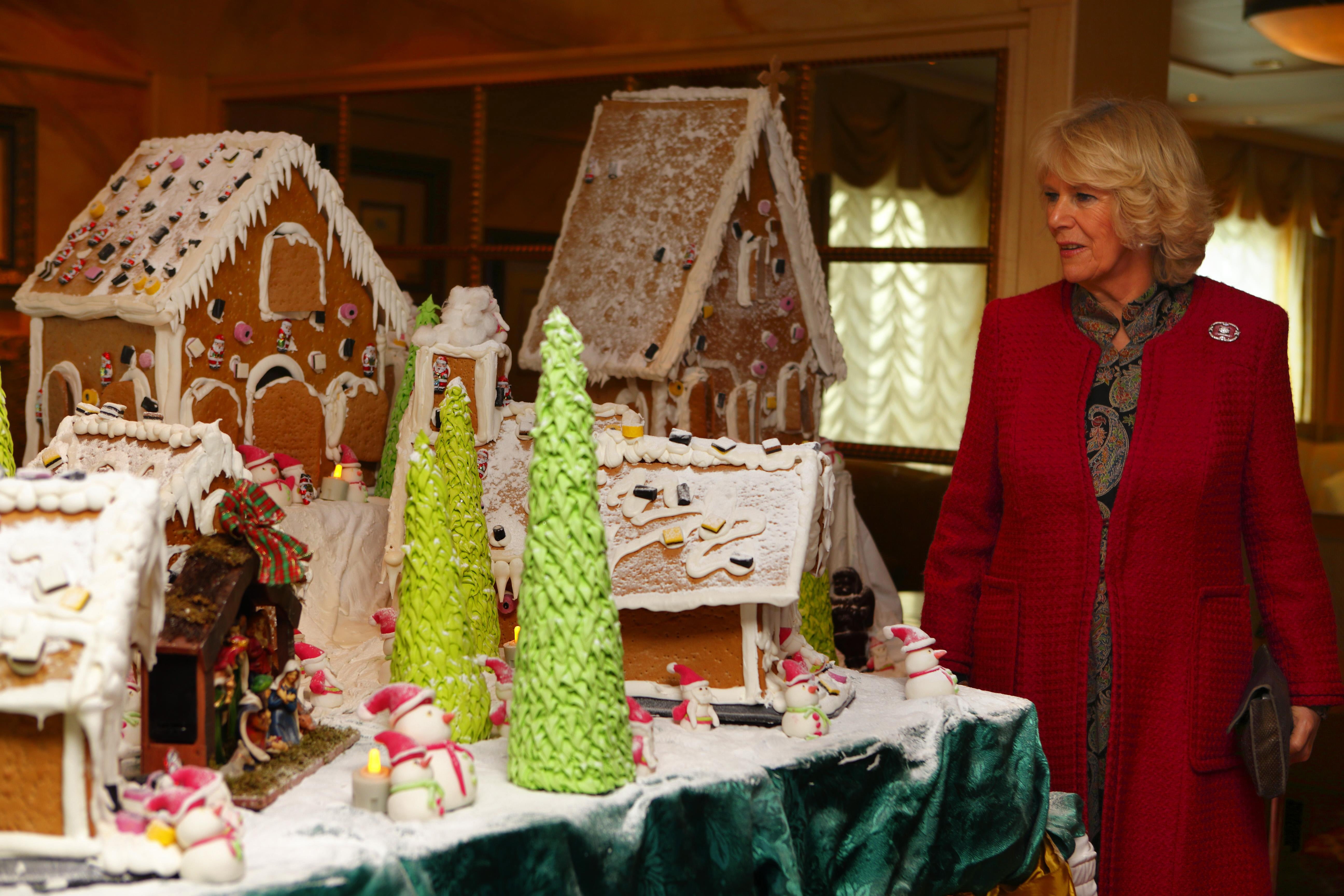 The Duchess of Cornwall views a gingerbread model village (Chris Ison/PA)