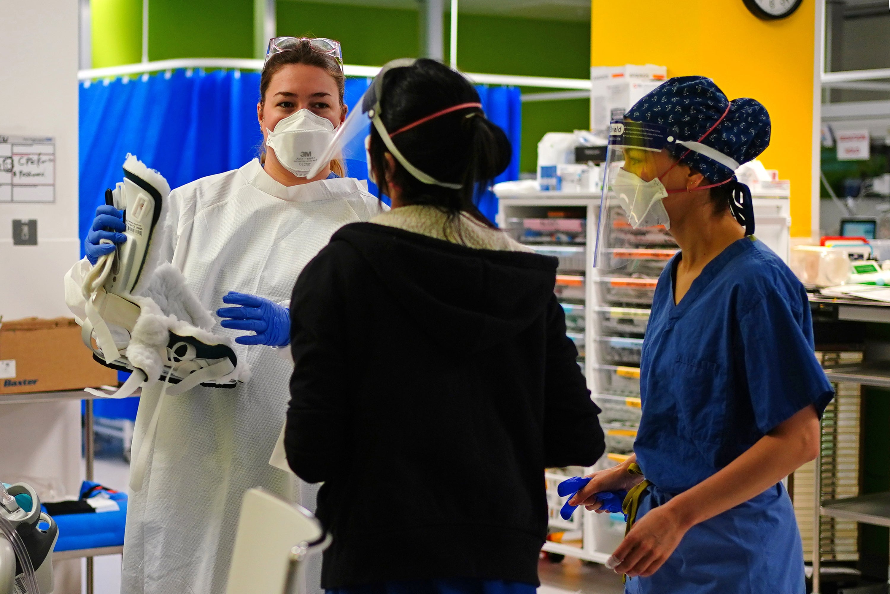 Medical staff wearing face masks in a critical care unit at King’s College Hospital (Victoria Jones/PA)