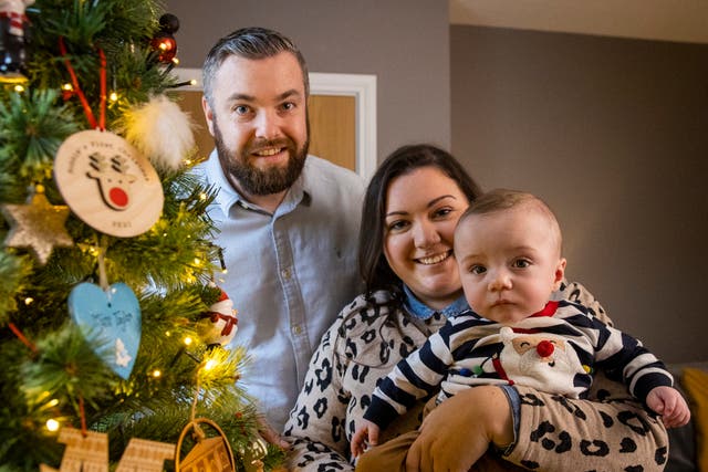 Martin and Gillian Johnston with their son Robert ‘Robbie’ Johnston at their home in Ballyclare, Northern Ireland (Liam McBurney/PA)