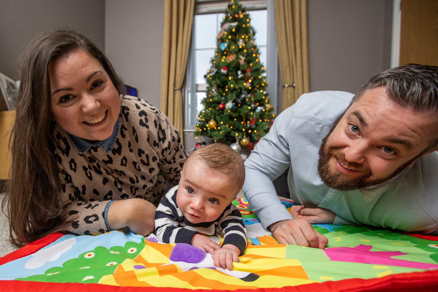 Martin and Gillian Johnston with their son Robert “Robbie’ Johnston at their home in Ballyclare, Northern Ireland. PA Photo. Picture date: Tuesday December 21 2021. See PA story ULSTER Baby. Photo credit should read: Liam McBurney/PA Wire