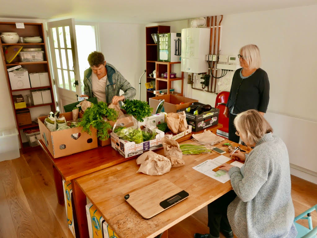 Cannock Mill Cohousing residents checking the communal food order