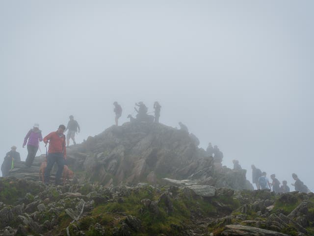 <p>The peak of Snowdon is often busy with walkers </p>