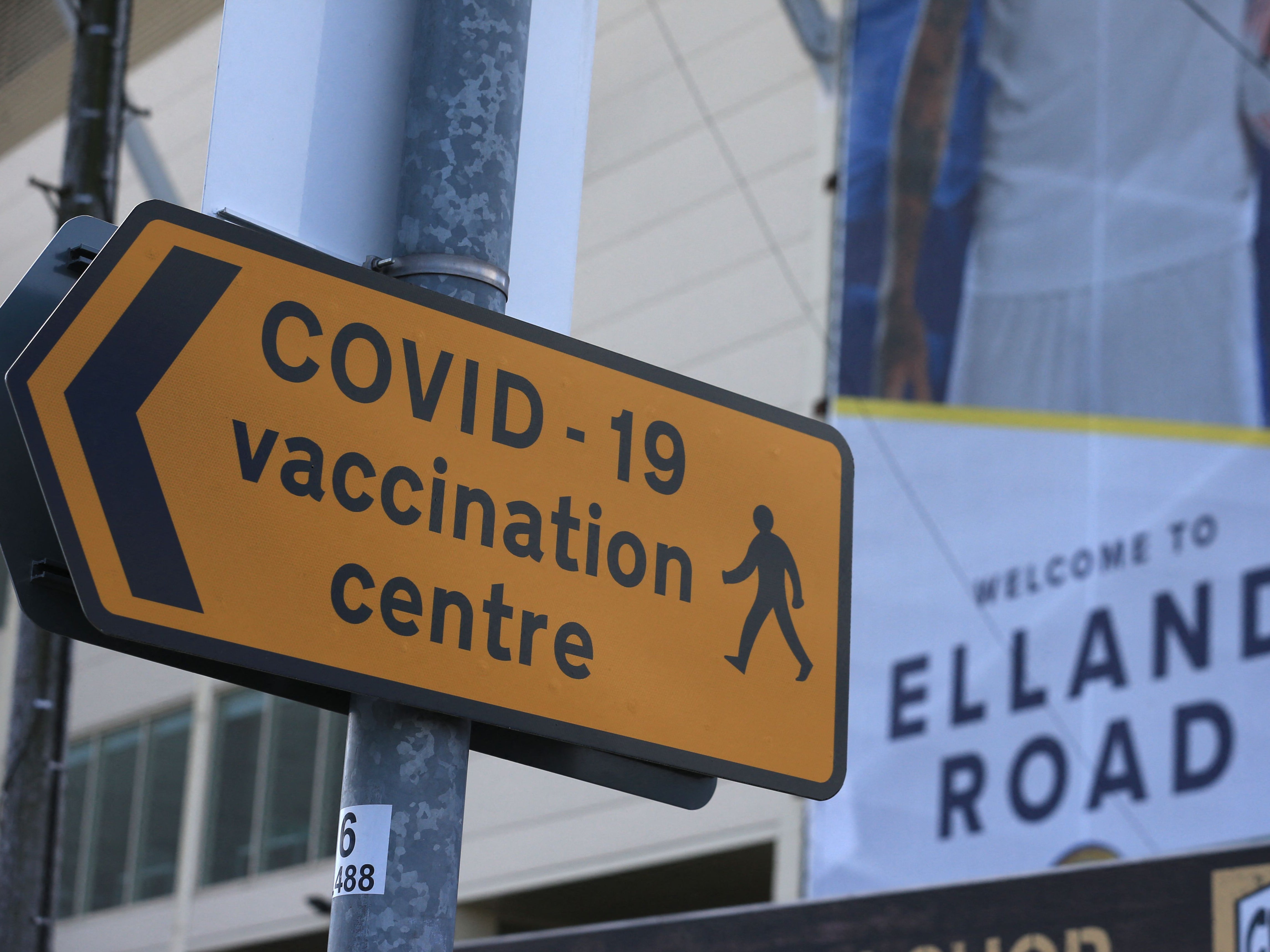 A street sign directs people to the Covid vaccination centre at Elland Road in Leeds