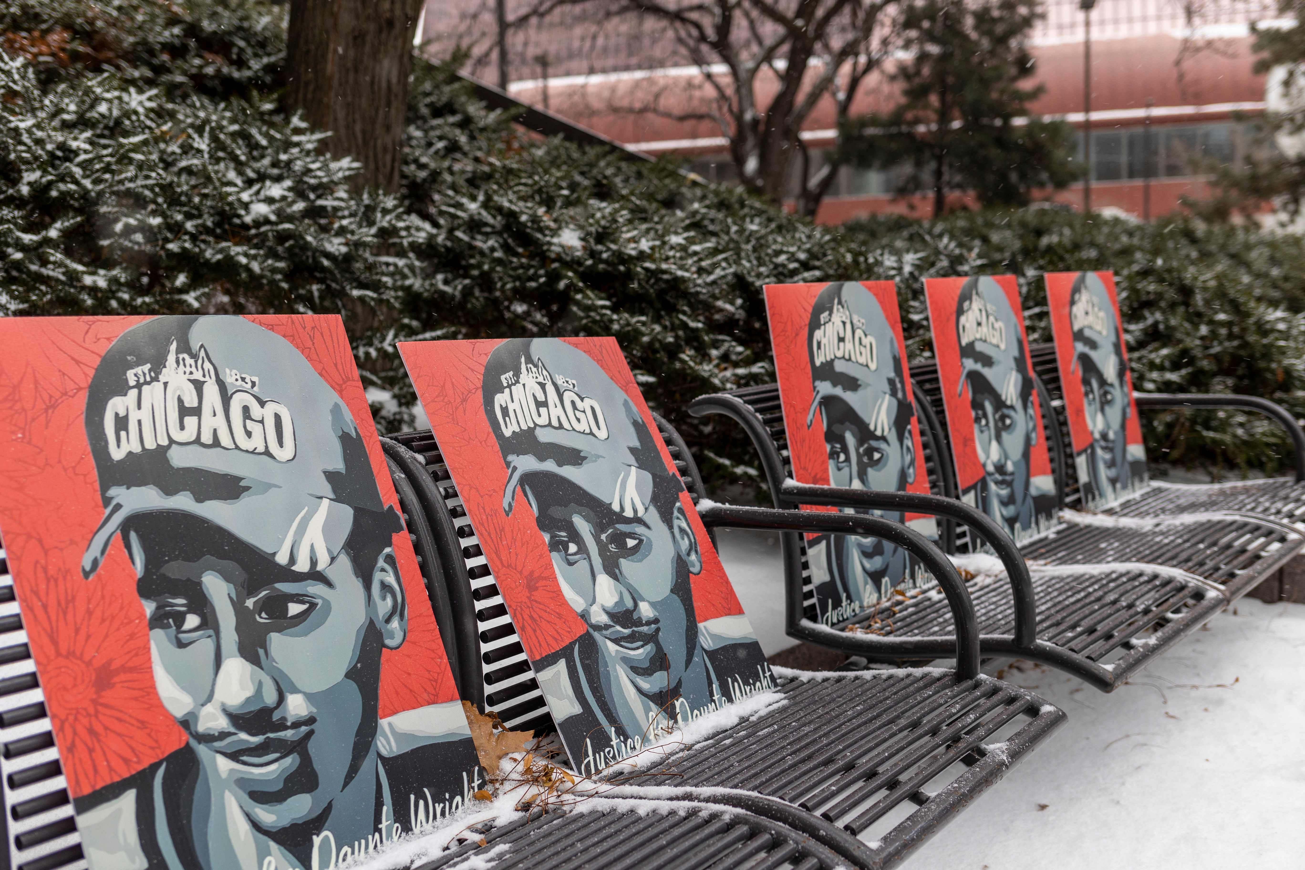 Pictures of Daunte Wright are left on benches outside the Hennepin County Government Center in Minneapolis, Minnesota, on 21 December as the jury deliberates