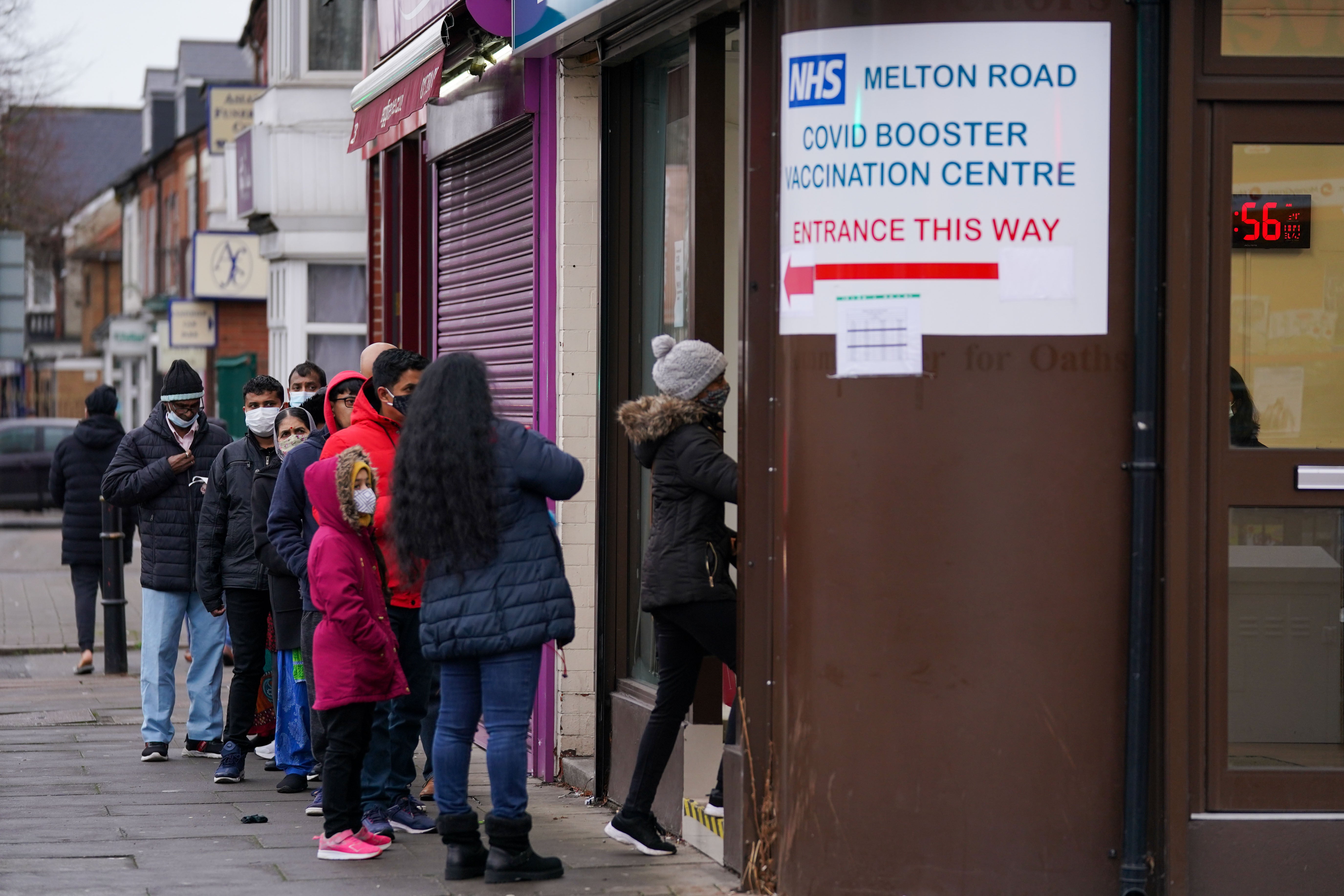 People queue at Melton Road Vaccination Centre in Leicester (PA)
