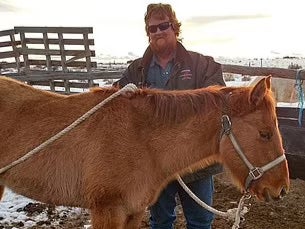 Brent Brown stands with a horse in a photo posted to Instagram