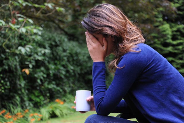 A woman showing signs of depression (Anna Gowthorpe/PA)