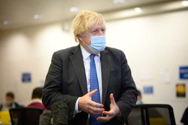 <p>Boris Johnson is being questioned over his Covid-19 strategy (Leon Neal/PA)</p>