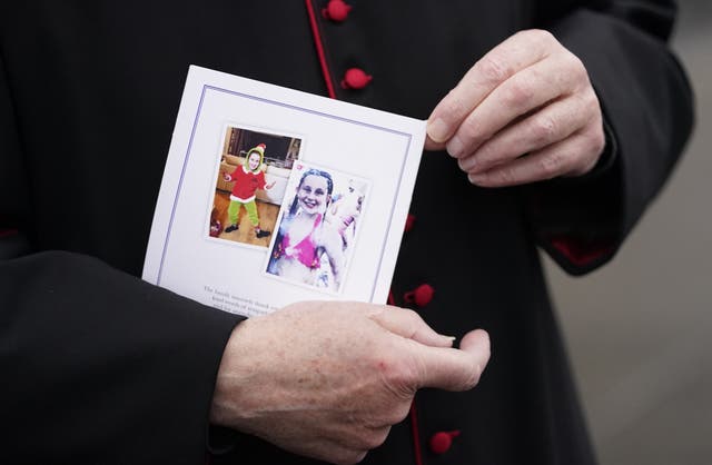 A member of the clergy holds the order of service for the funeral of Ava White (Danny Lawson/PA)