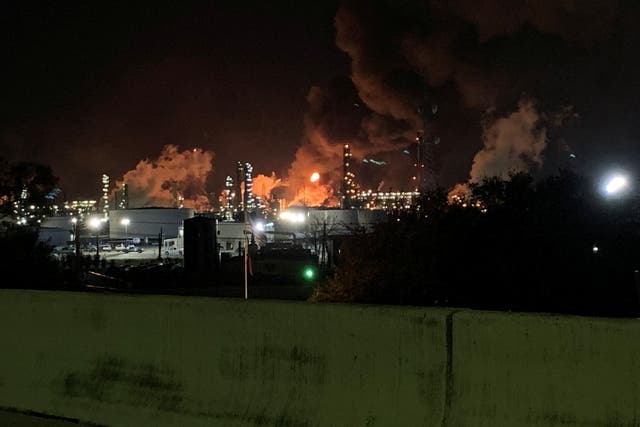 <p>View from the road of a fire at petrochemical company ExxonMobil's refinery near Houston in Baytown, Texas</p>