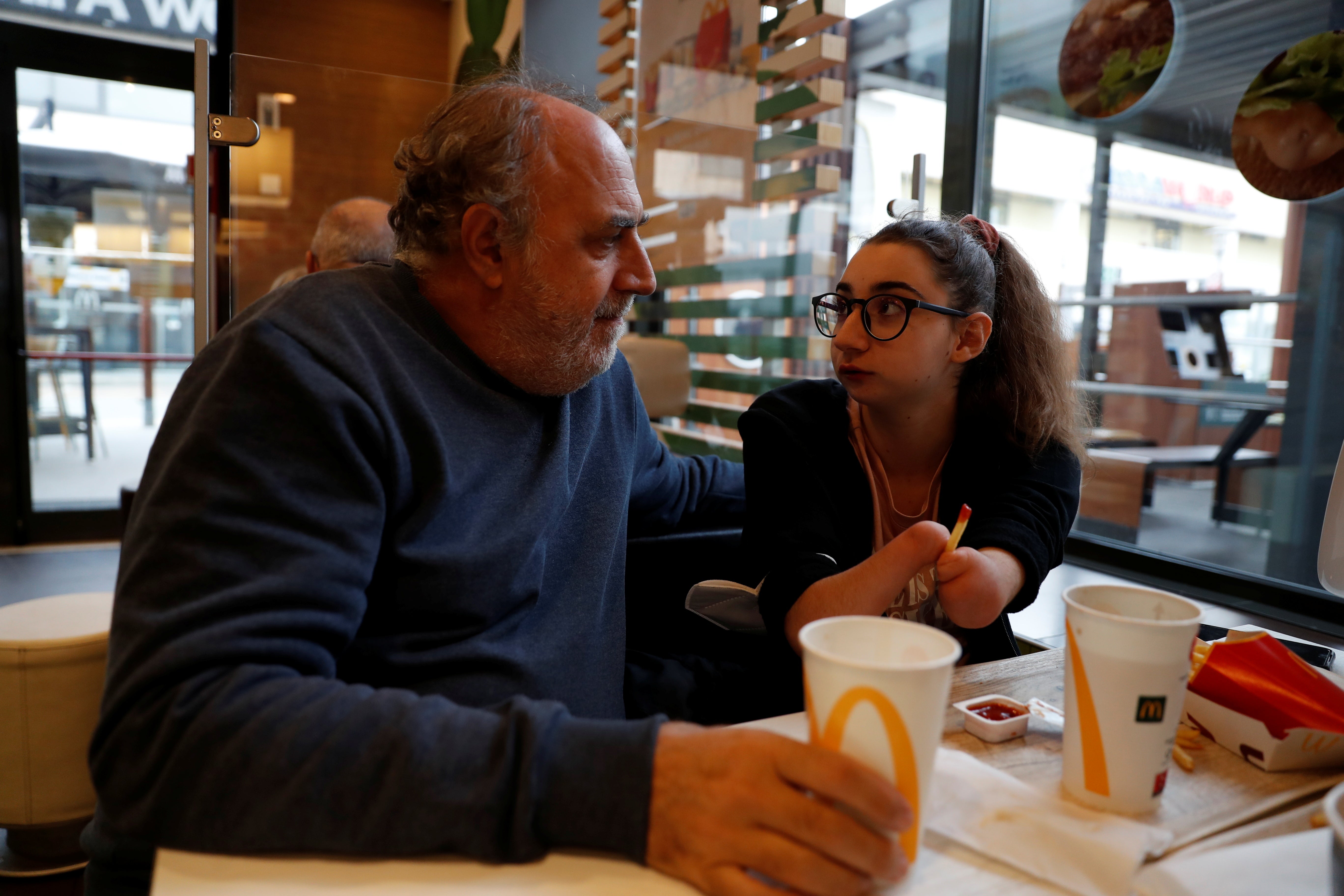 Francesca has lunch with her father, Marco Cesarini, after a training session