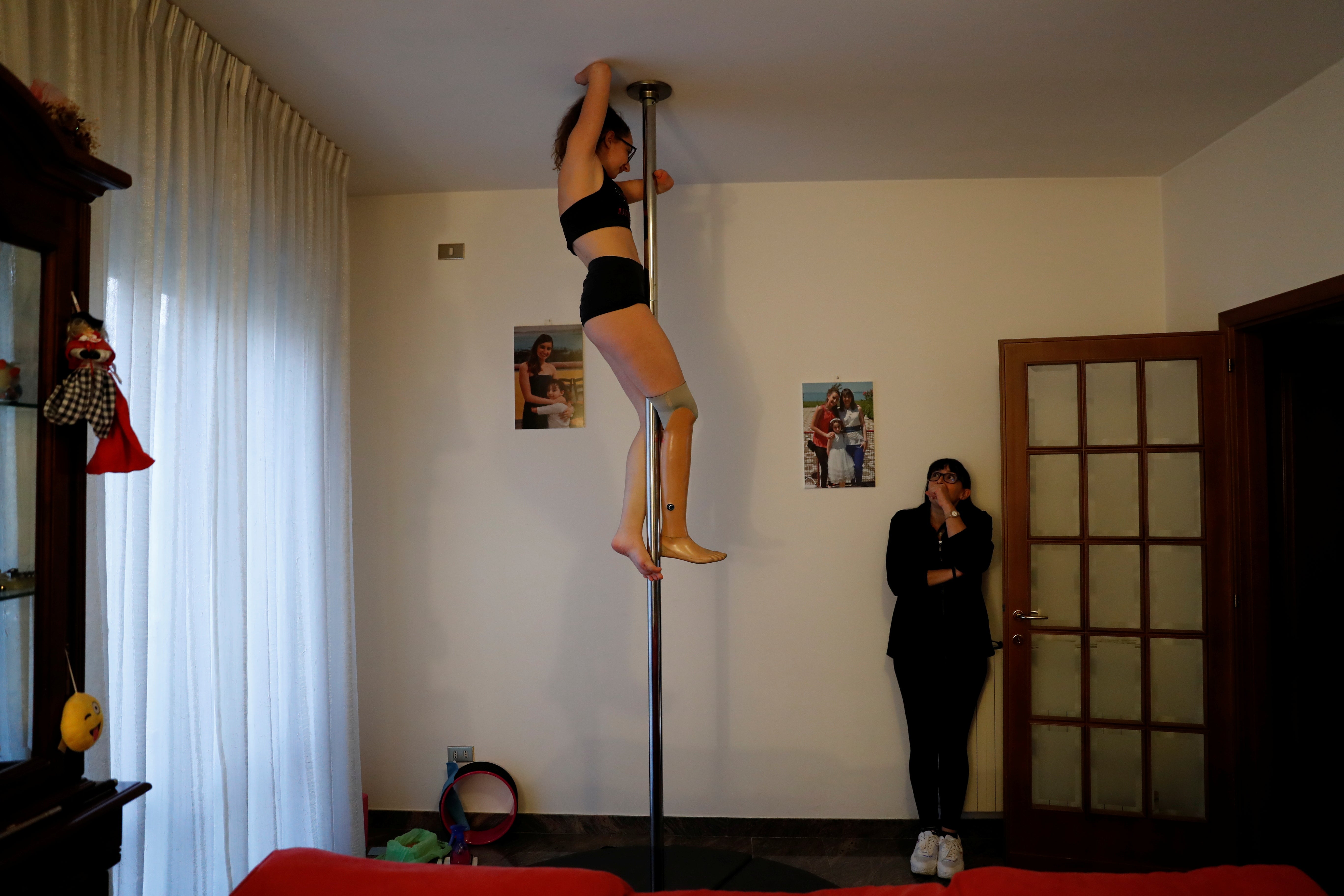 Francesca practises at home while her mother watches