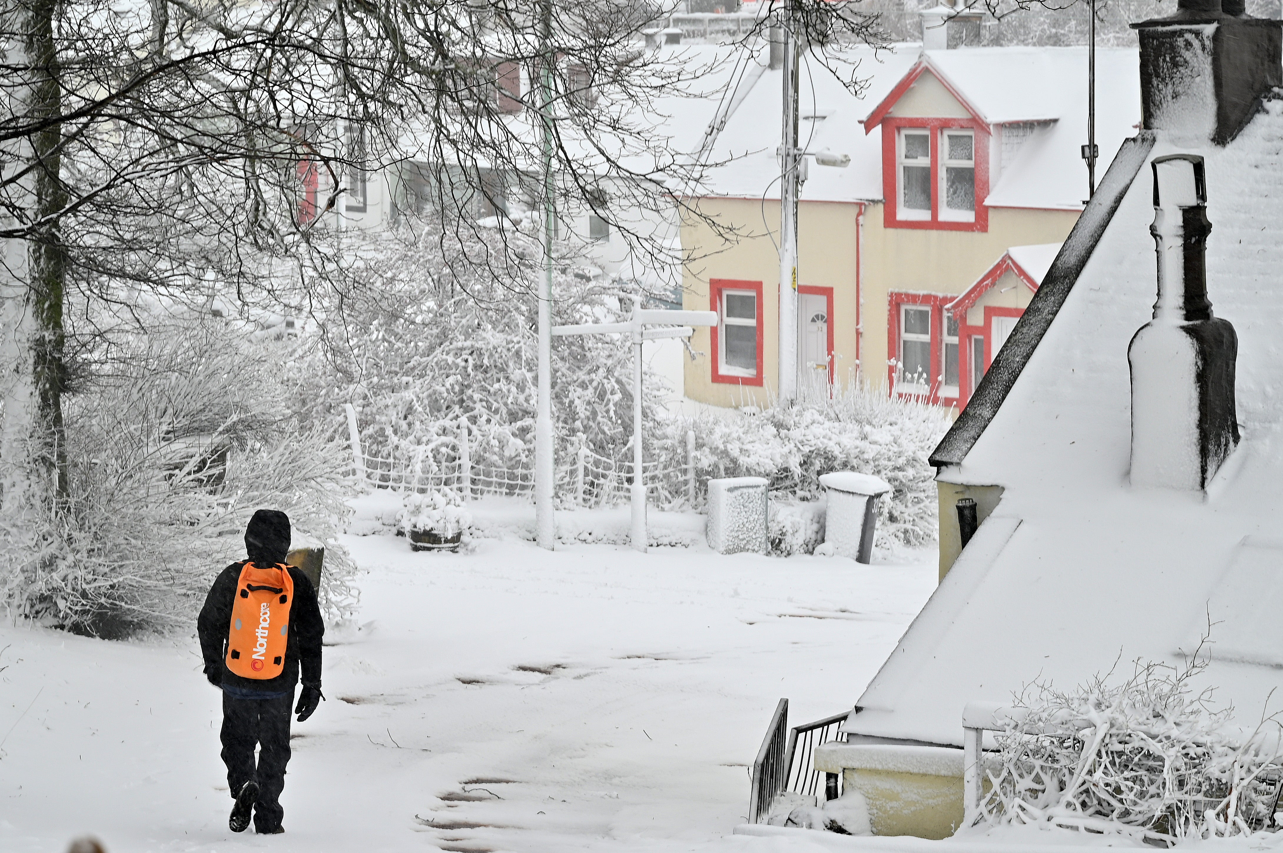 Members of the public make their way through the snow in the village of Leadhills on December 07, 2021 in Leadhills, Scotland