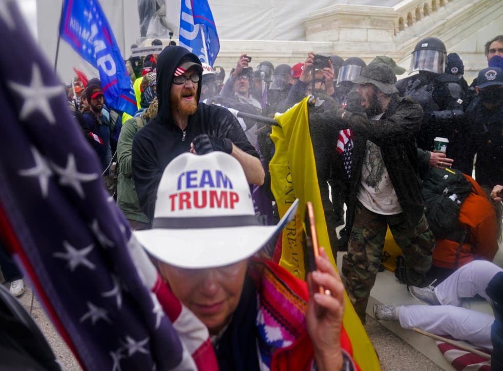 <p>Trump supporters try to break through a police barrier at the Capitol in Washington, on 6 January, 2021, as Congress prepared to affirm President-elect Joe Biden's victory</p>