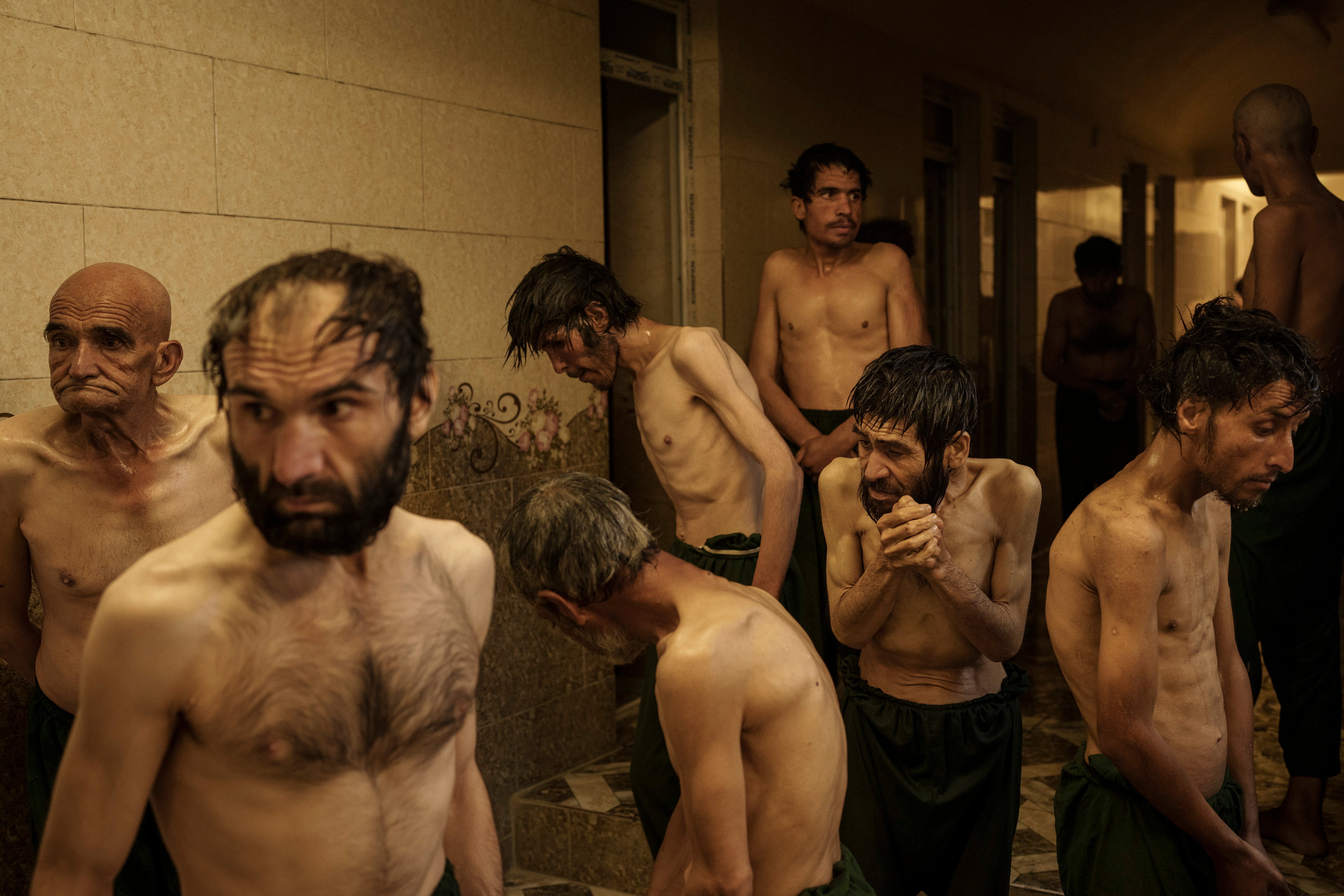Drug users detained during a Taliban raid wait to be shaved after arriving at Avicenna Medical Hospital for Drug Treatment in Kabul, Afghanistan, on Oct. 1, 2021.