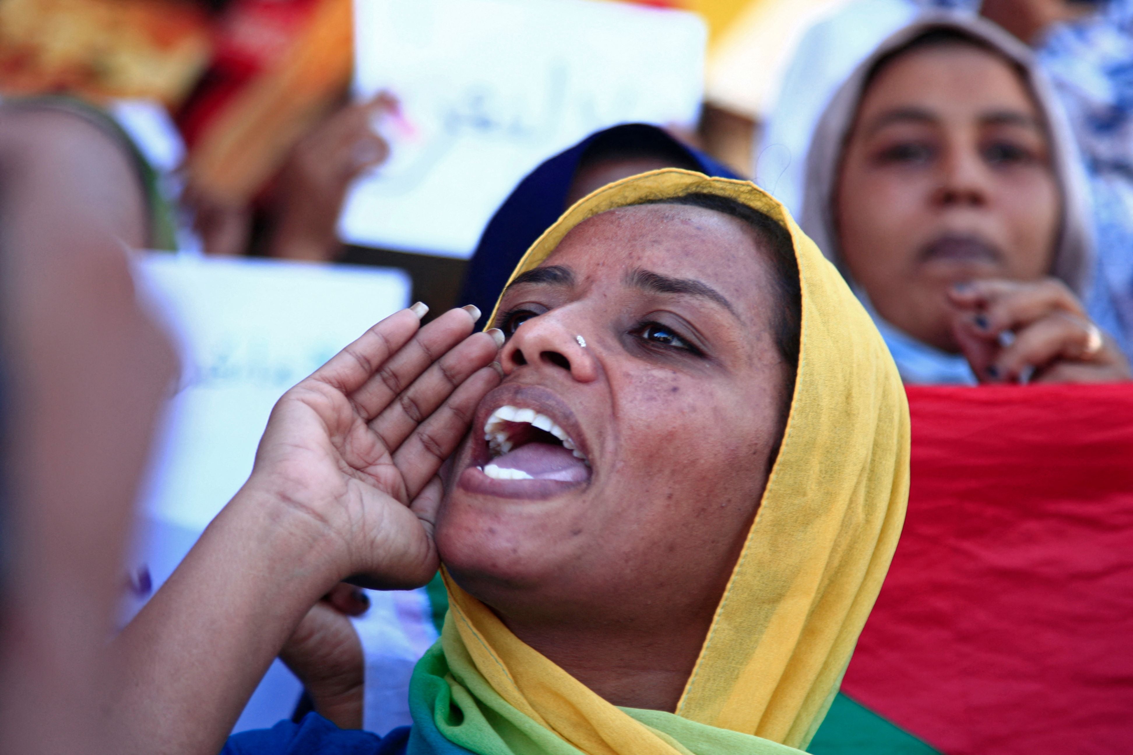 Sudanese women take part in a protest decrying sexual attacks, after the UN said at least 13 women and girls were raped in the recent mass protests against the army