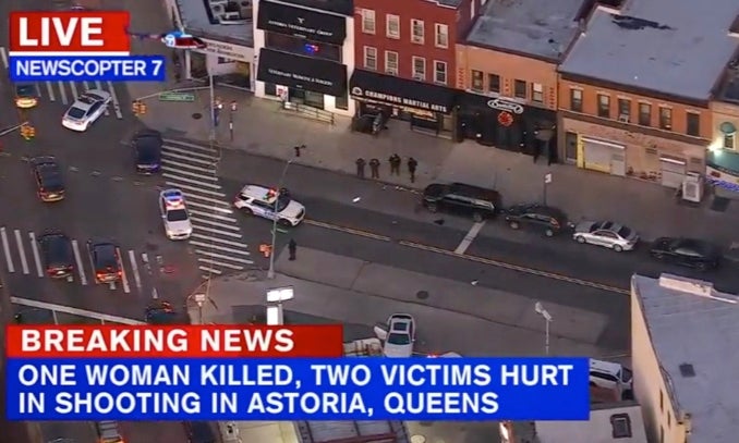 An aerial image of NYPD officers on the scene of the shooting along Steinway Street in Astoria, Queens