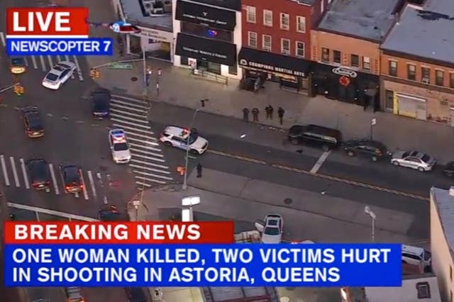 <p>An aerial image of NYPD officers on the scene of the shooting along Steinway Street in Astoria, Queens </p>