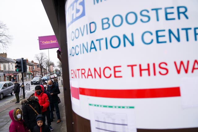 People queue at a vaccination centre in Leicester (Jacob King/PA)