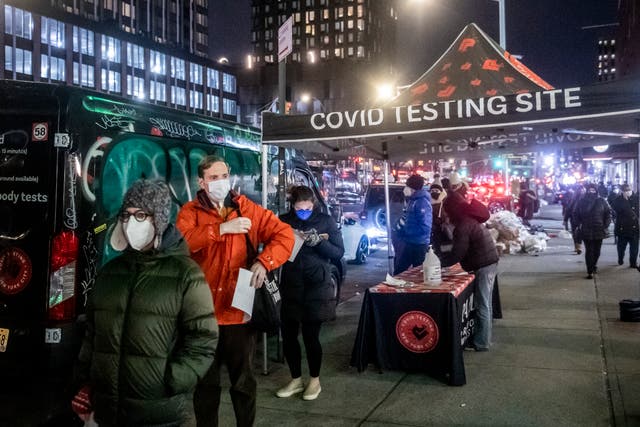 <p>People wait on line to get tested for Covid-19 on the Lower East Side of Manhattan</p>