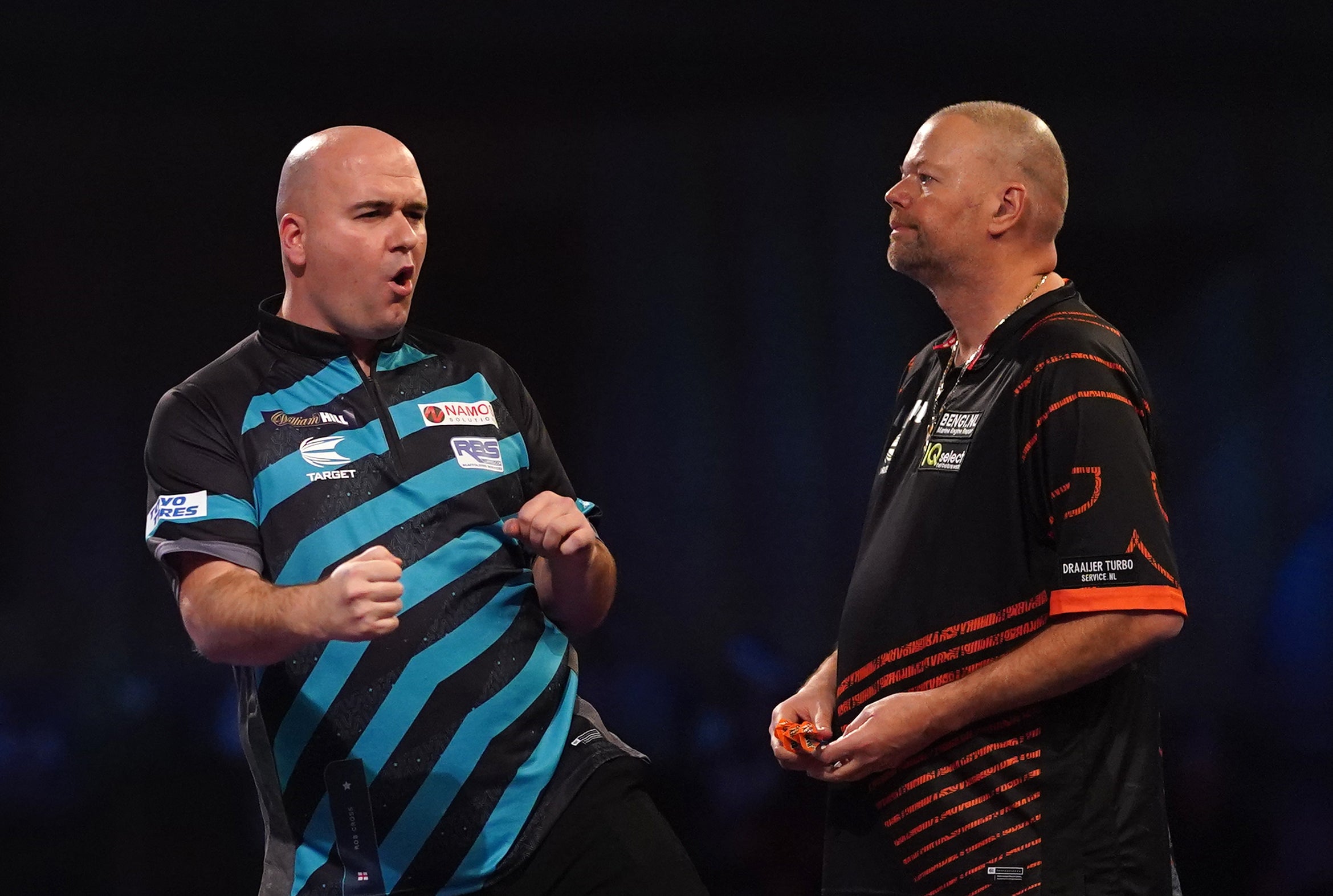 Rob Cross, left, shows his delight during his victory over Raymond Van Barneveld (Adam Davy/PA)