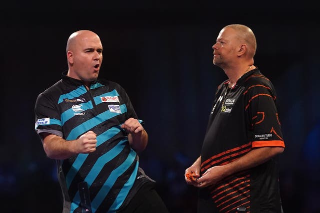Rob Cross, left, shows his delight during his victory over Raymond Van Barneveld (Adam Davy/PA)