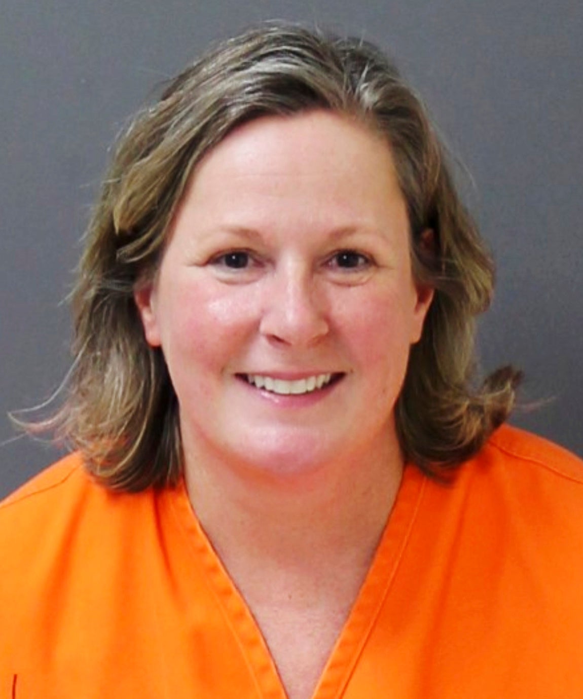 Kim Potter smiles in her mugshot after being found guilty on all charges