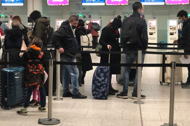 <p>Long haul: passengers in the check-in queue at Gatwick airport</p>