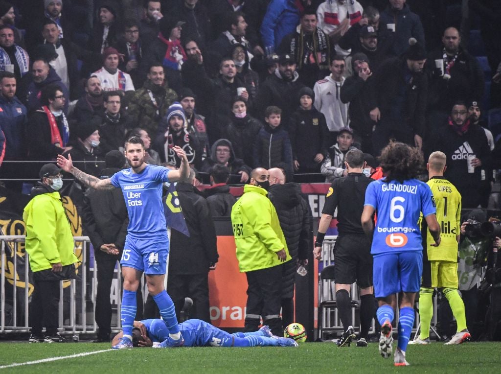 Marseille midfielder Dimitri Payet is hit by a bottle of water during the Ligue 1 fixture at Lyon, on 21 November. The incident led to the game being abandoned and Lyon were docked a point